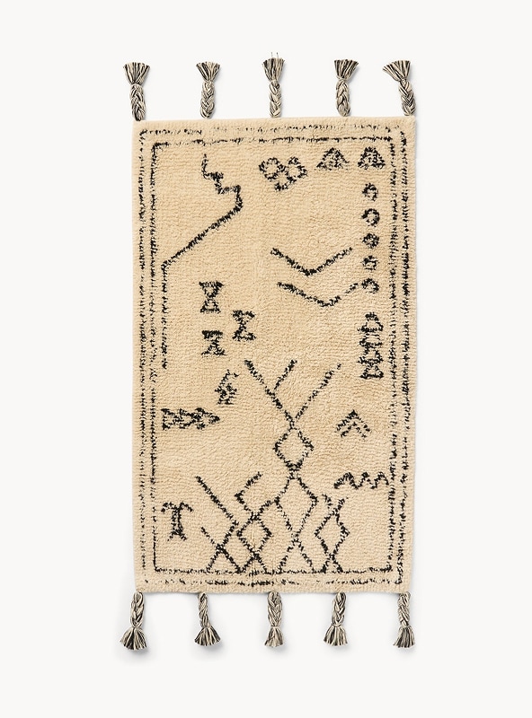 Tappeto con motivo geometrico e nappine Tappeto con motivo geometrico e nappine