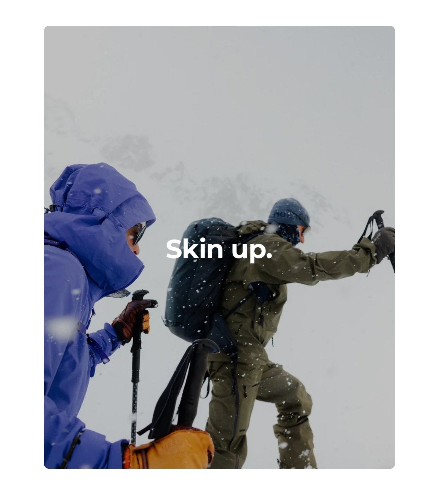 an image of two people in ski gear on a snowy day