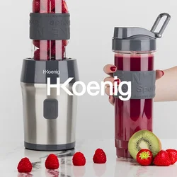 Frullatore con base in acciaio inox, parte superiore trasparente riempita di lamponi, abbinato a una borraccia sportiva grigio scuro, smoothie verdi e rossi.