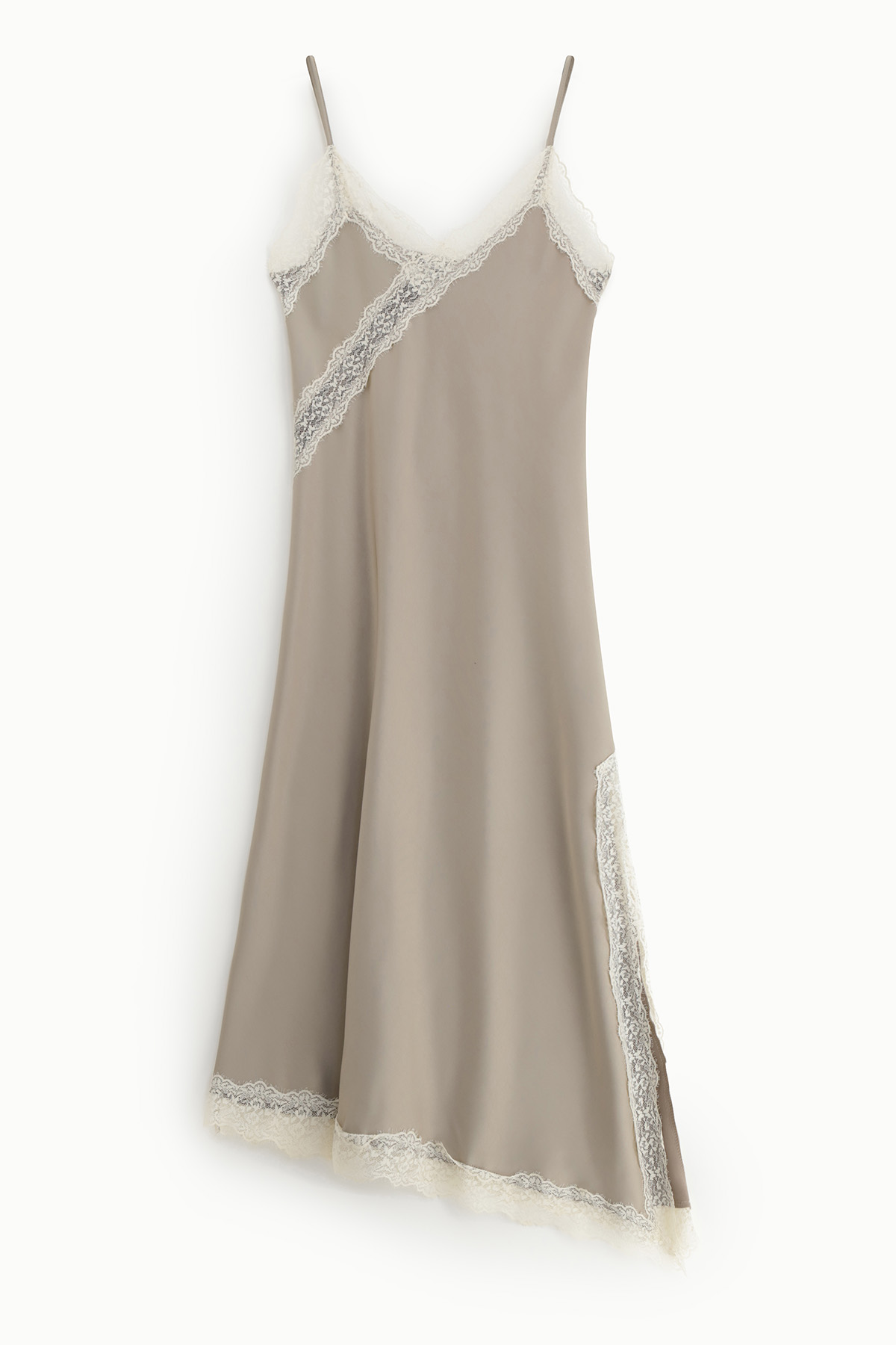 Beige silk slip dress with white lace trim, V-neck and thin spaghetti straps, flowing skirt with side slit