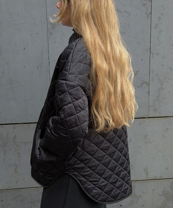 an image of a woman with long blonde hair talking on a cell phone