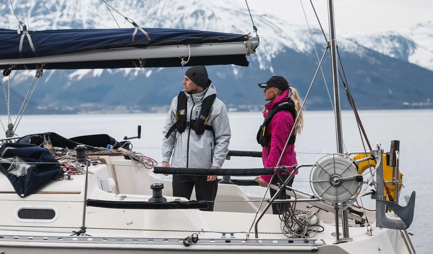 Two sailors on a boat in Helly Hansen gear