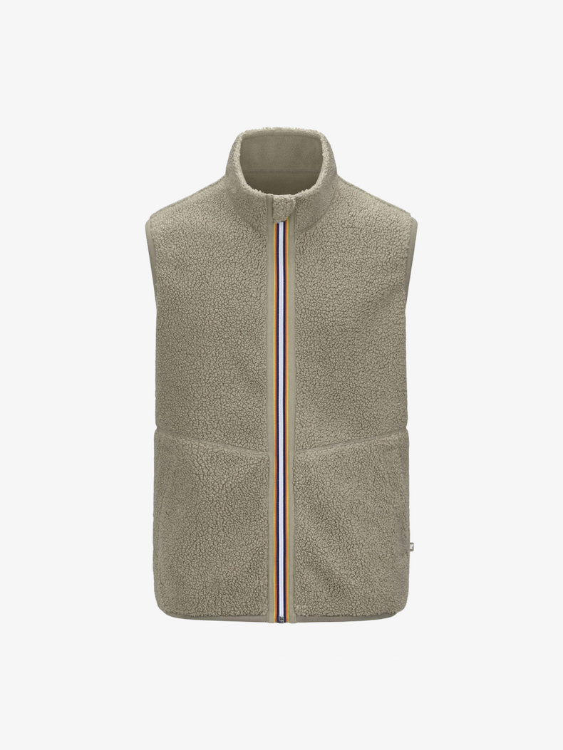 an image of a man wearing a light gray jacket with a hood