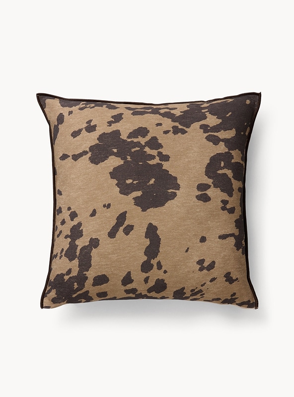 Cuscino stampa muccata con overlock a contrasto 45x45cm