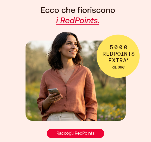 Donna sorridente all&rsquo;aperto in un prato primaverile tiene uno smartphone in mano. In alto il testo: &ldquo;Ecco che fioriscono i RedPoints&rdquo;, con &ldquo;i RedPoints&rdquo; evidenziato in rosso corsivo e sottolineato. A destra un bollino giallo indica: &ldquo;5000 RedPoints extra da 69&euro;&rdquo;. In basso pulsante rosso: &ldquo;Raccogli RedPoints&rdquo;.