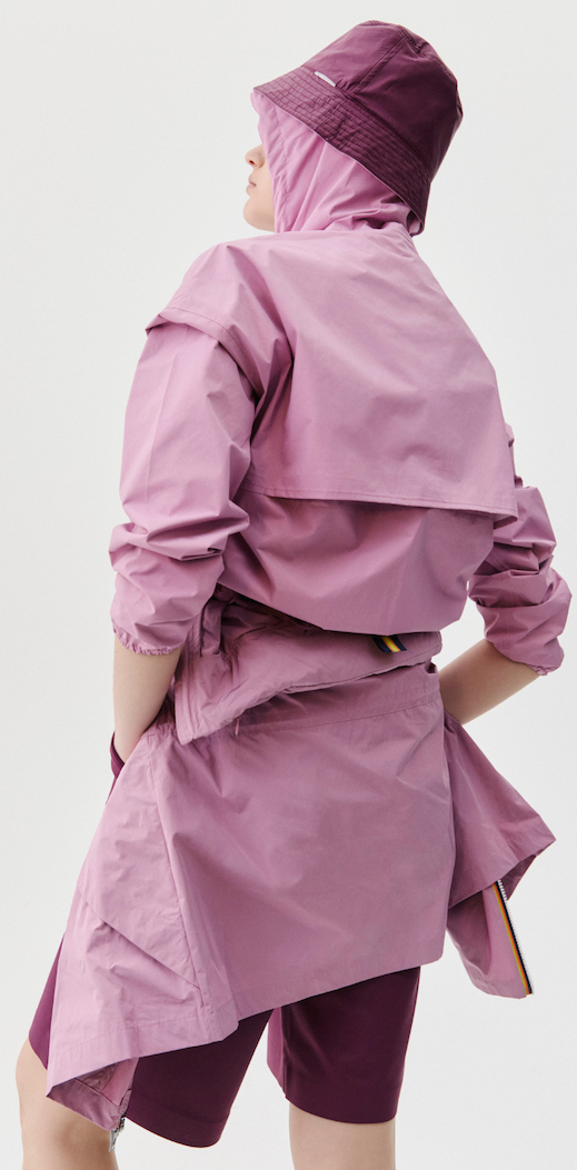 an image of a man wearing a light gray jacket with a hood