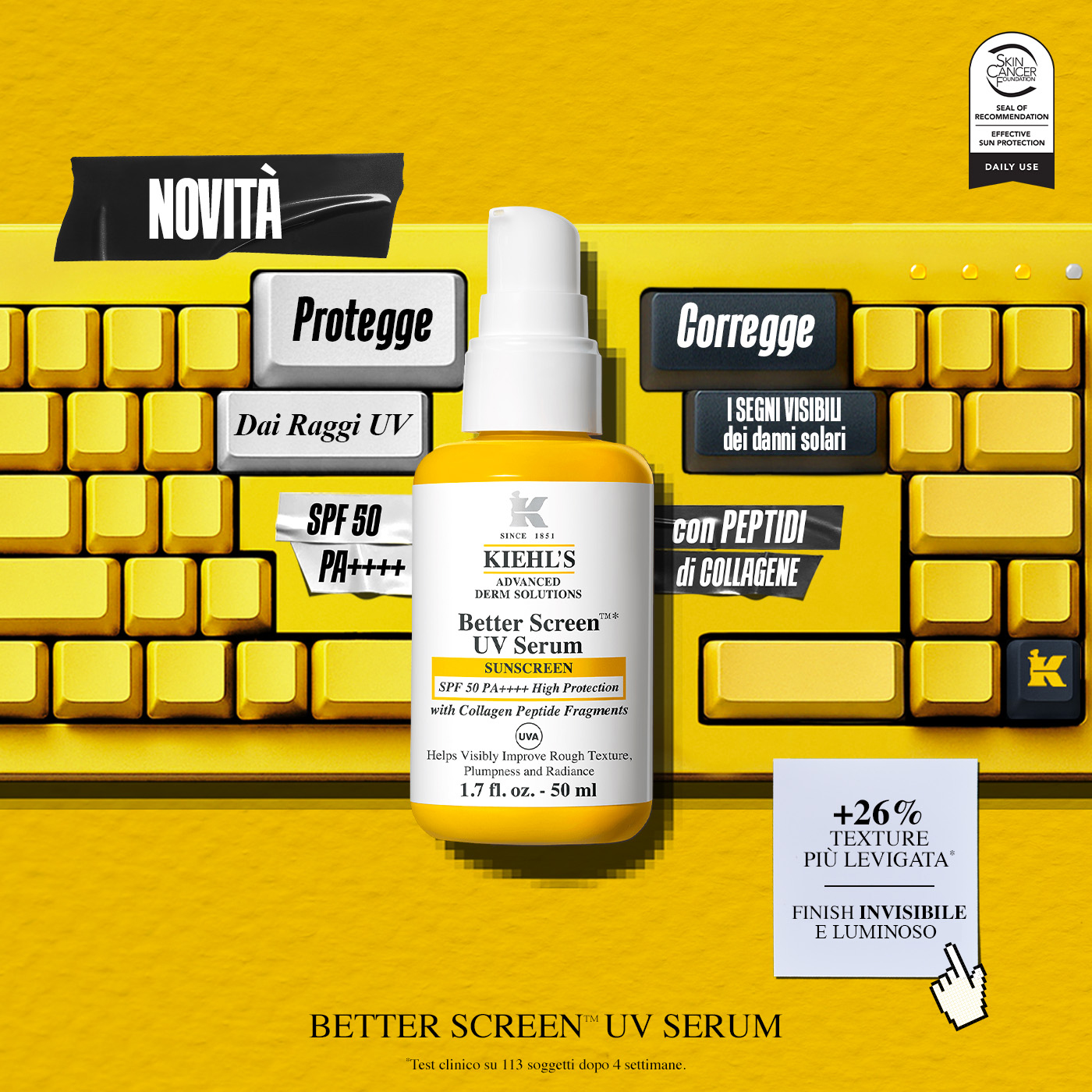 Flacone di Kiehl's Better Screen UV Serum SPF 50 posizionato sopra una tastiera gialla.