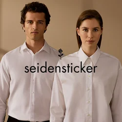 Camicie bianche con bottoni per uomini e donne, caratterizzate da colletto classico, trama liscia e vestibilità su misura, su uno sfondo neutro.