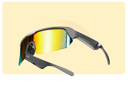 Sporty smart sunglasses with wraparound mirrored yellow-orange lens, grey angular frame and built-in temple electronics for audio
