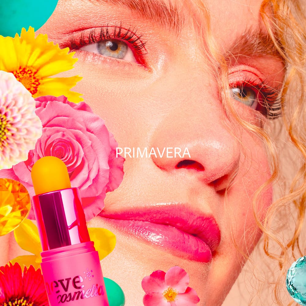 Close-up of a woman's face with glossy pink lips, colourful spring flowers and a pink lip-balm stick, with 'PRIMAVERA' text