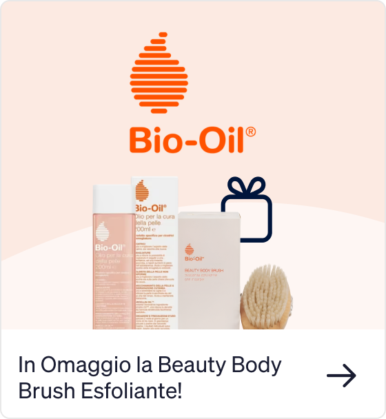 Bio‑Oil bottle and boxed free beauty body brush with wooden bristles and Bio‑Oil logo on a pale peach background