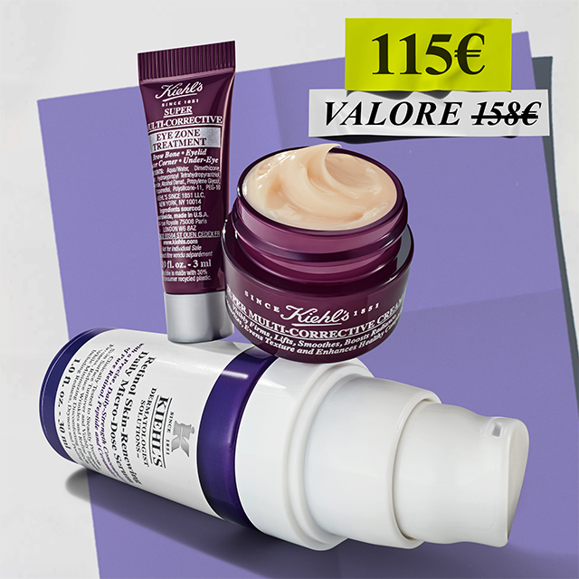 Routine anti-et&agrave; Kiehl's Age-Less Experts con Retinol Micro-Dose Serum, Super Multi-Corrective Cream e Eye Zone Treatment su sfondo viola dinamico.
