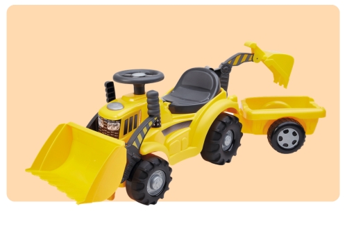 Yellow ride-on toy tractor with front loader and detachable rear trailer on pale peach background