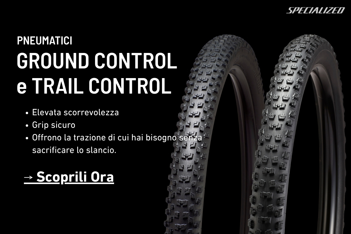 Two black mountain bike tyres with knobbly treads on a black background alongside 'Ground Control & Trail Control' product text and Specialized logo