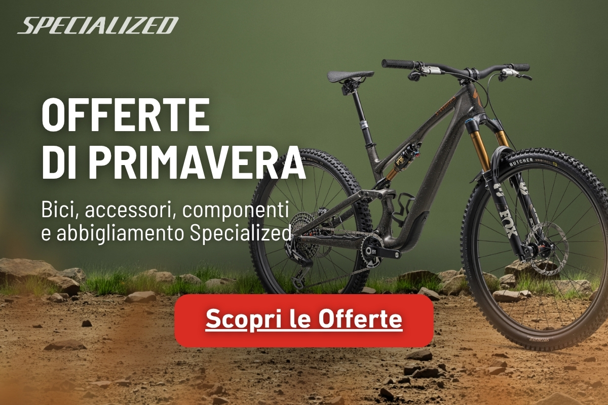 Specialized full-suspension mountain bike on a rocky trail with a red "Discover Offers" button and spring sale text