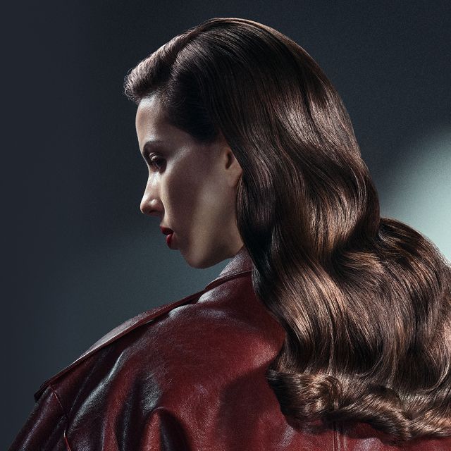 Model with a loose, soft Siren waves hairstyle, achieved using Dyson Beauty devices.