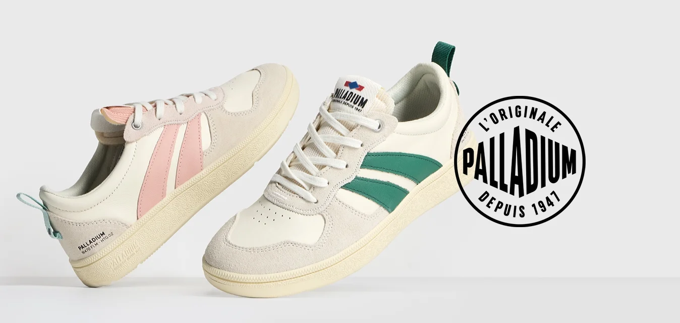 Sneakers crema chiaro con accenti rosa e verdi, materiale in pelle, punta rotonda, suola in gomma e strisce laterali a contrasto.