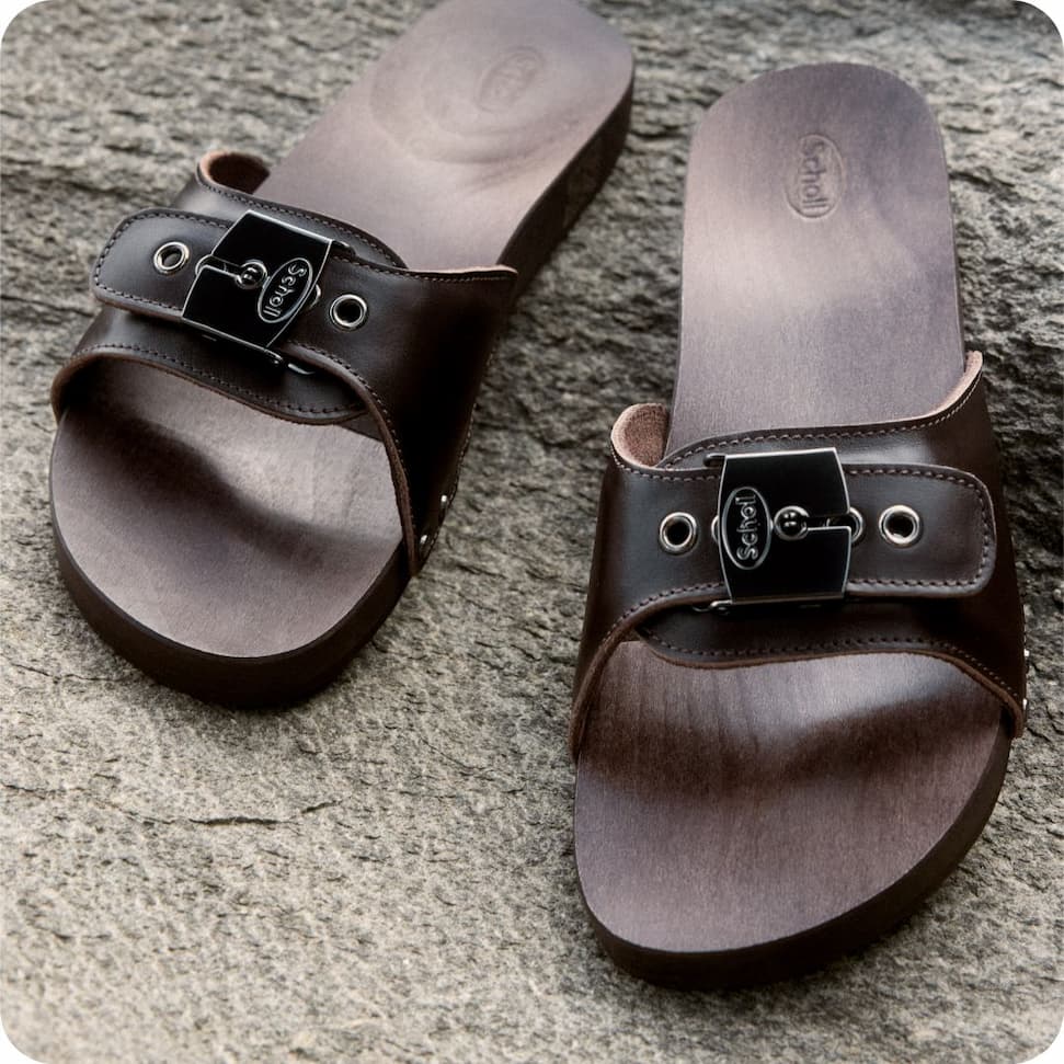 an image of a man sitting on a chair by a pool