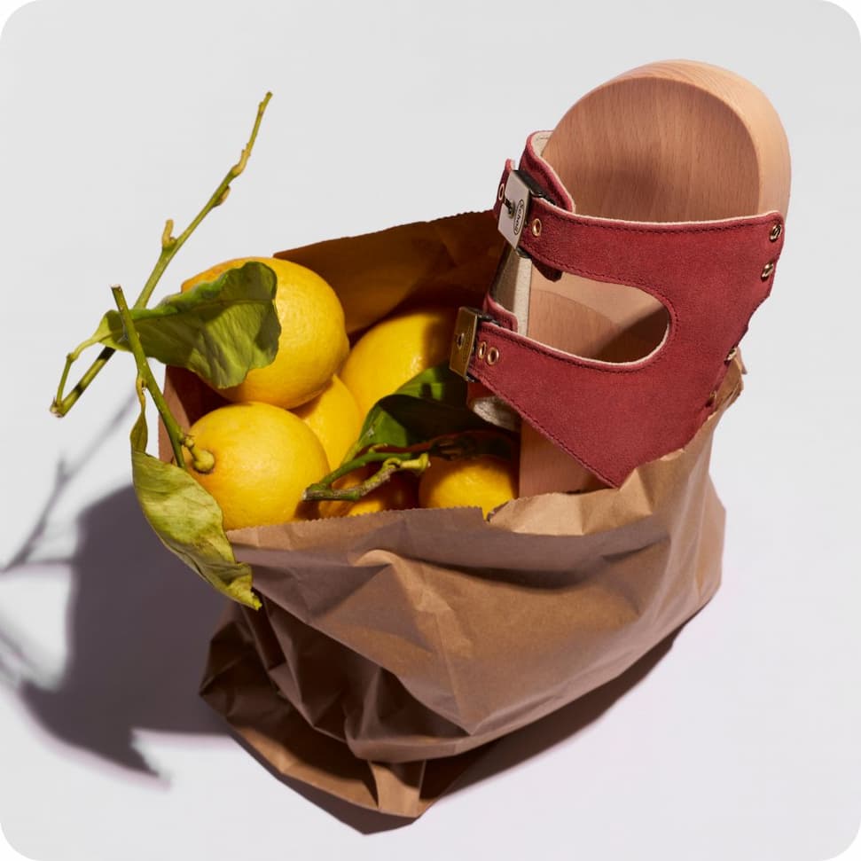 an image of a man sitting on a chair by a pool