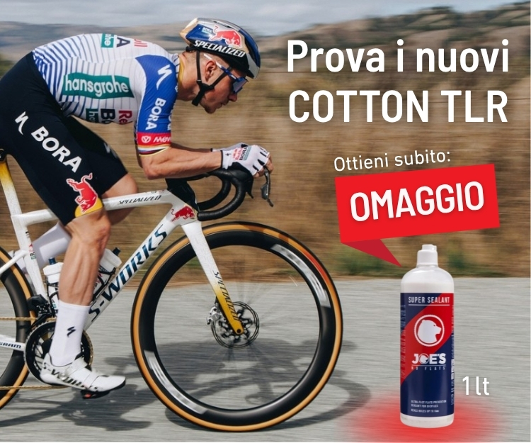 Cyclist in racing kit on S‑Works bike with promotional banner for Cotton TLR and free 1L Joe's Super Sealant bottle
