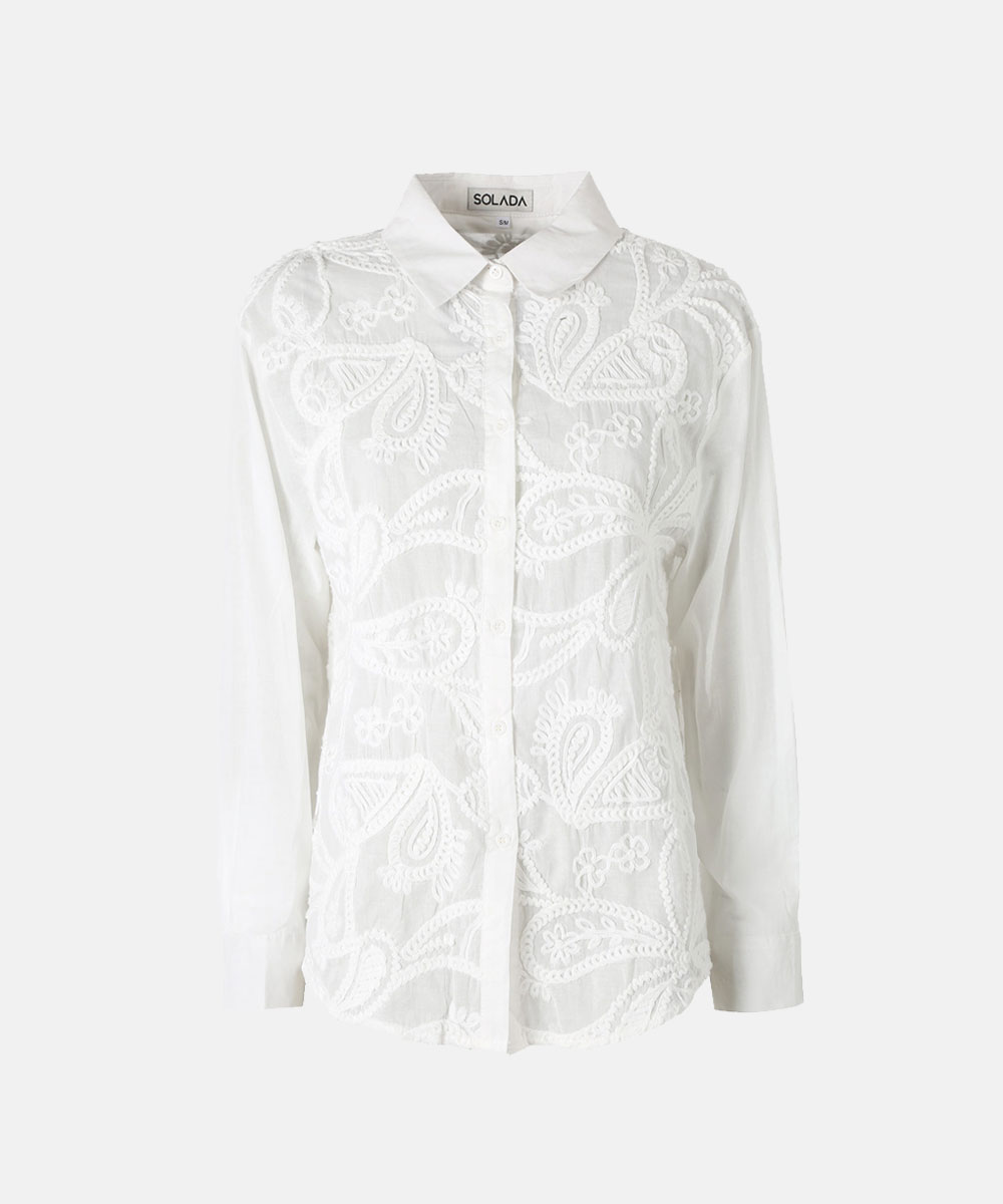 White long-sleeve collared shirt with button front and intricate white paisley and floral embroidery on a plain background