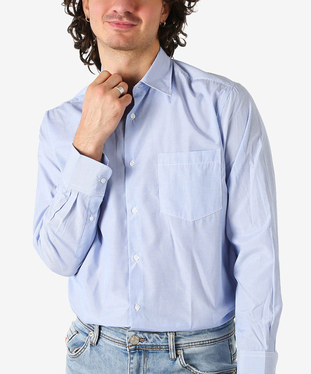 Man adjusting collar wearing light-blue pinstripe long-sleeve shirt tucked into jeans with visible chest pocket