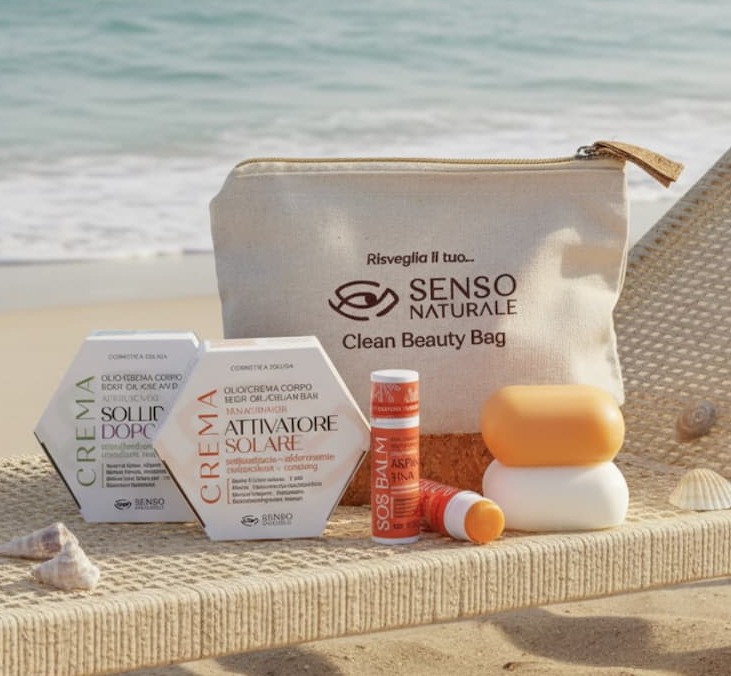 Beach scene with skincare products and a beauty bag.