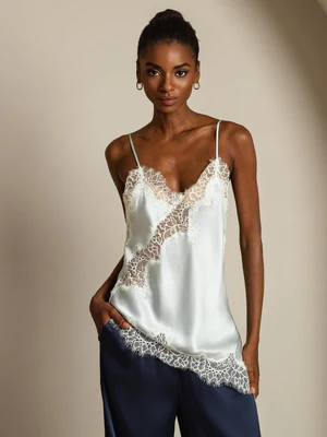 Image of Top in seta pura con spalline sottili in pizzo e orlo asimmetrico