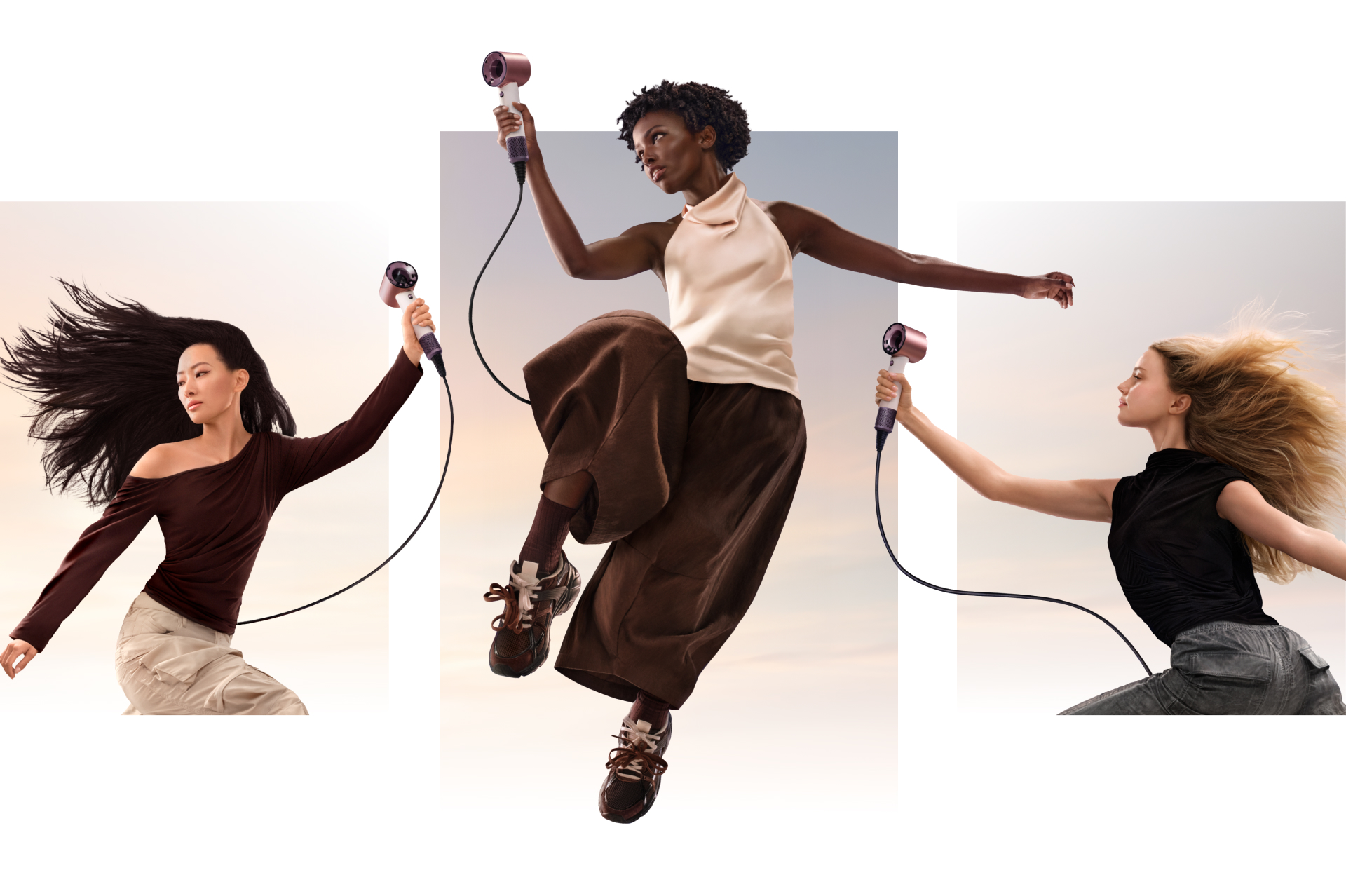 Model holding Dyson Supersonic Travel hair dryer.