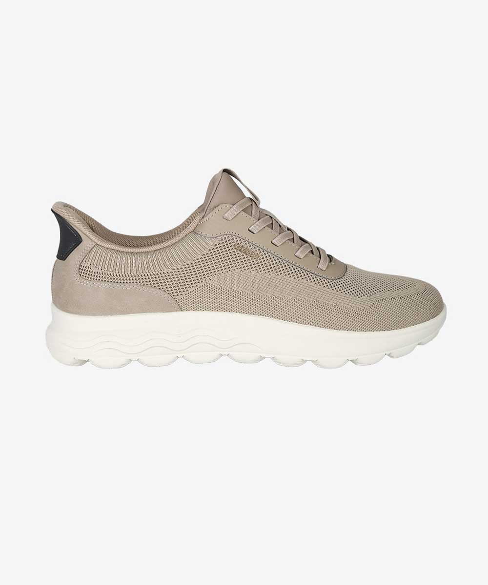 Beige knitted low-top trainer with lace-up fastening and chunky white sole