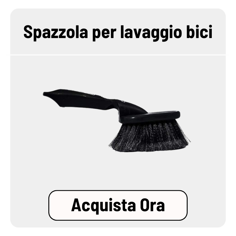 Black bike cleaning brush with angled ergonomic handle and dense bristles on white background