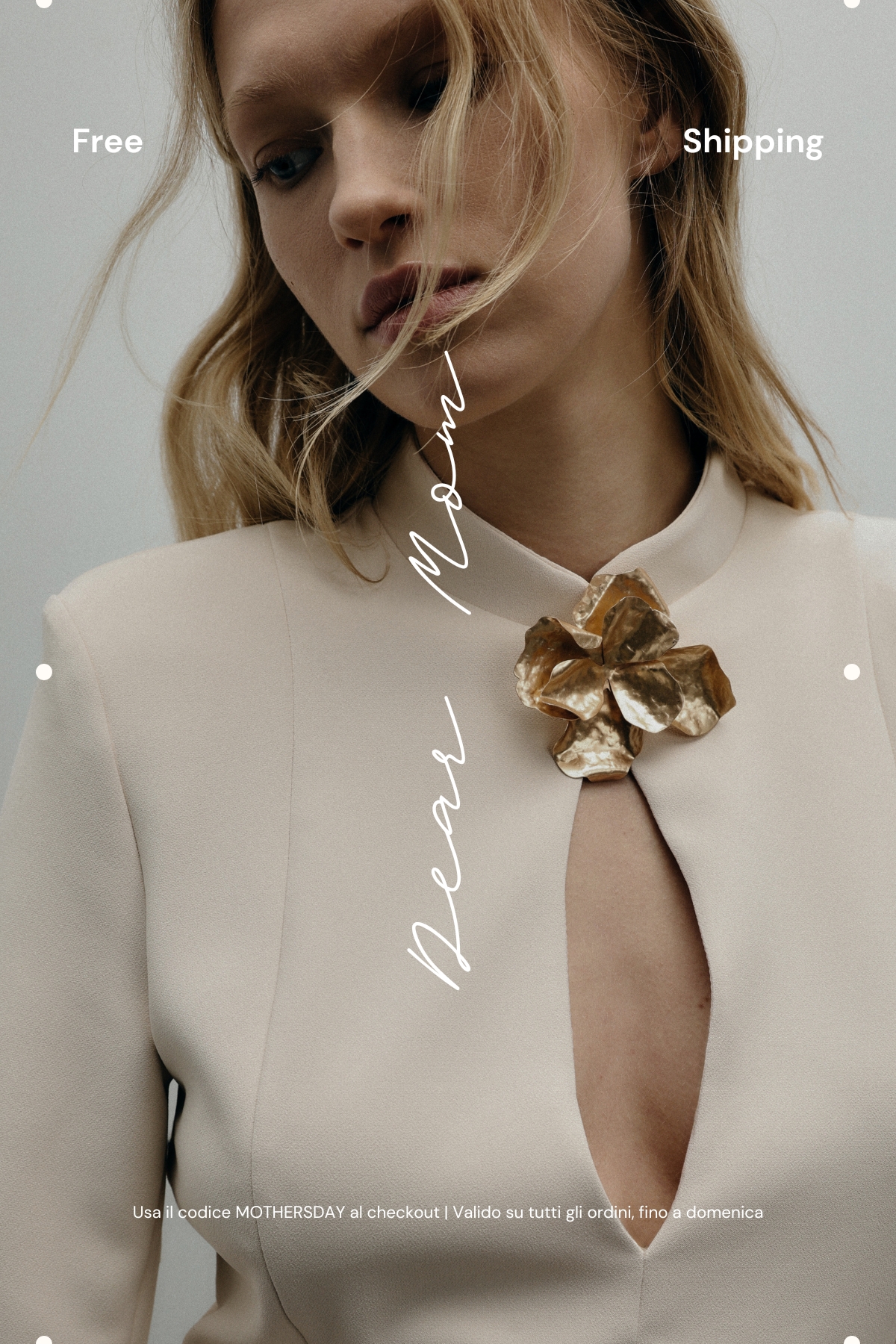 Close-up portrait of a woman in a cream dress with keyhole neckline wearing a gold flower brooch, soft gaze and 'Dear Mom' text overlay