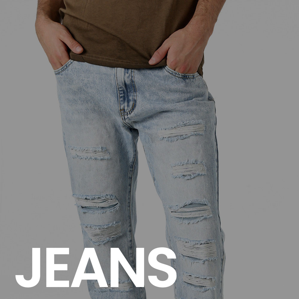 Man wearing light blue ripped slim-fit jeans and brown T-shirt with hands in pockets on grey studio background, product shot