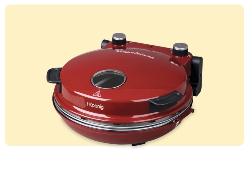 Red H.Koenig electric countertop pizza oven with domed lid, front viewing window and control knobs