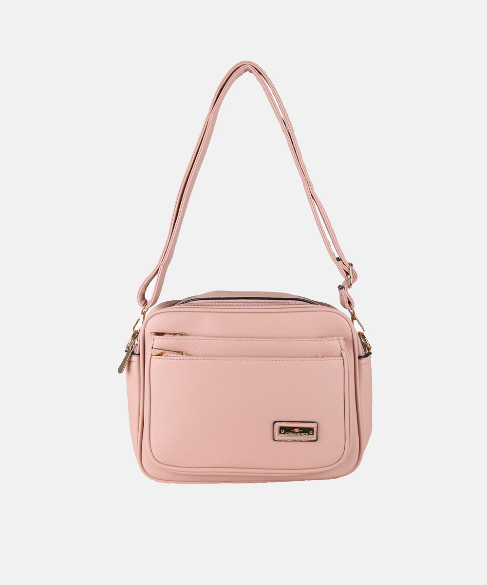 Blush pink faux-leather shoulder bag with adjustable strap, gold‑tone hardware, front zip pockets and rectangular silhouette