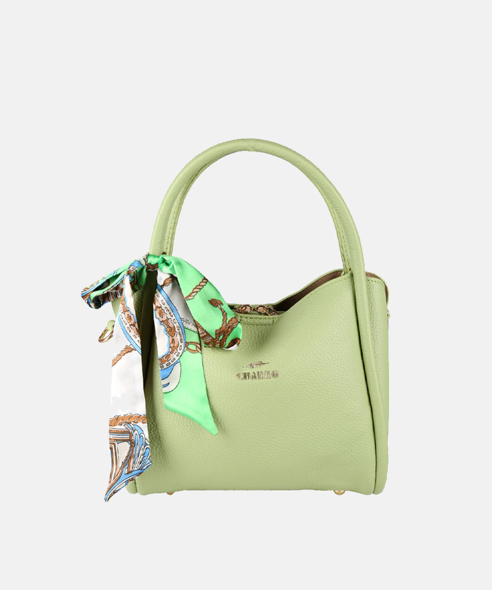 Light green pebbled leather handbag with top handles, gold logo and patterned green-white silk scarf tied to a handle