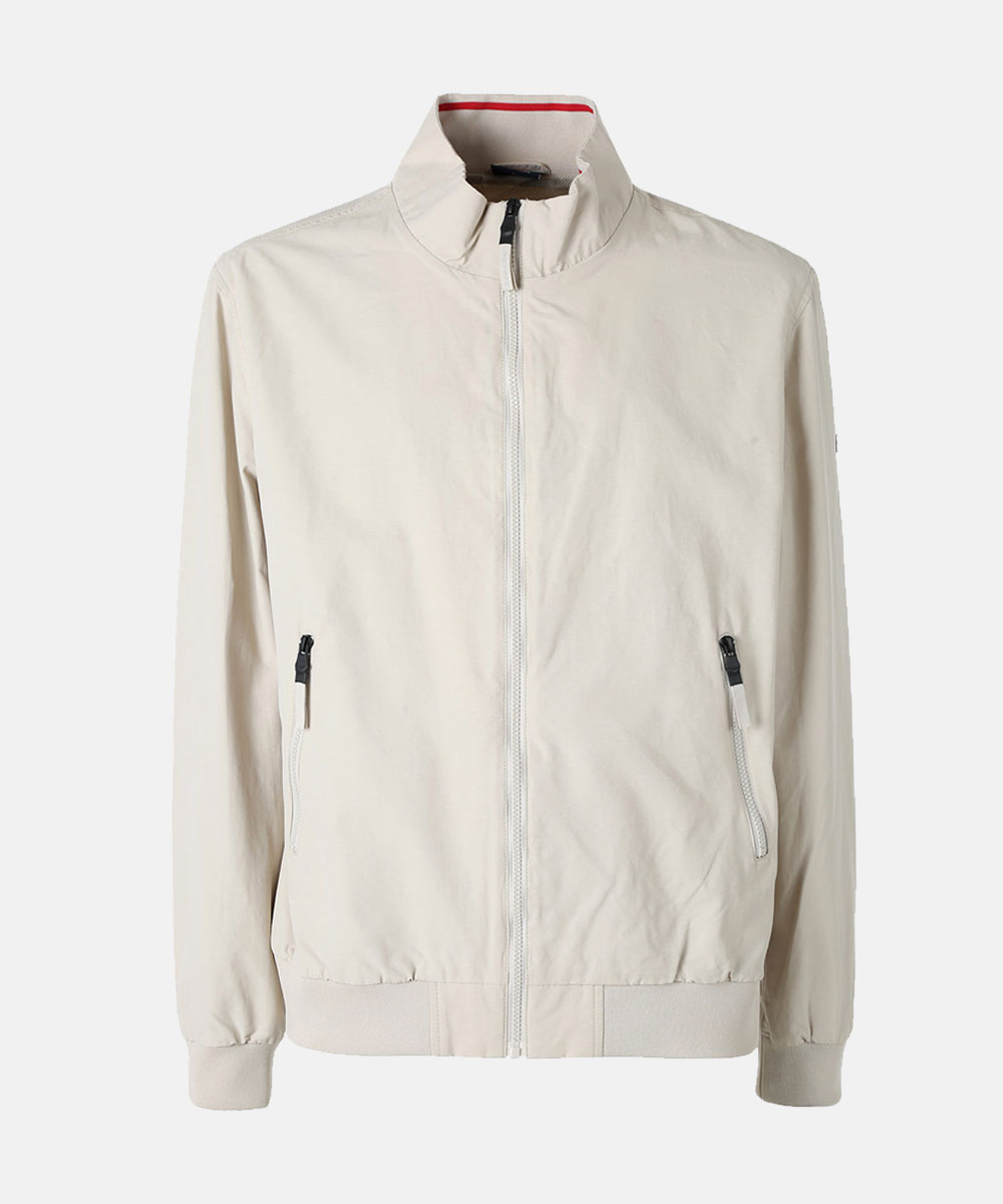 Beige lightweight bomber jacket with stand collar, full front zip, zip pockets, ribbed cuffs and hem, red inner collar trim