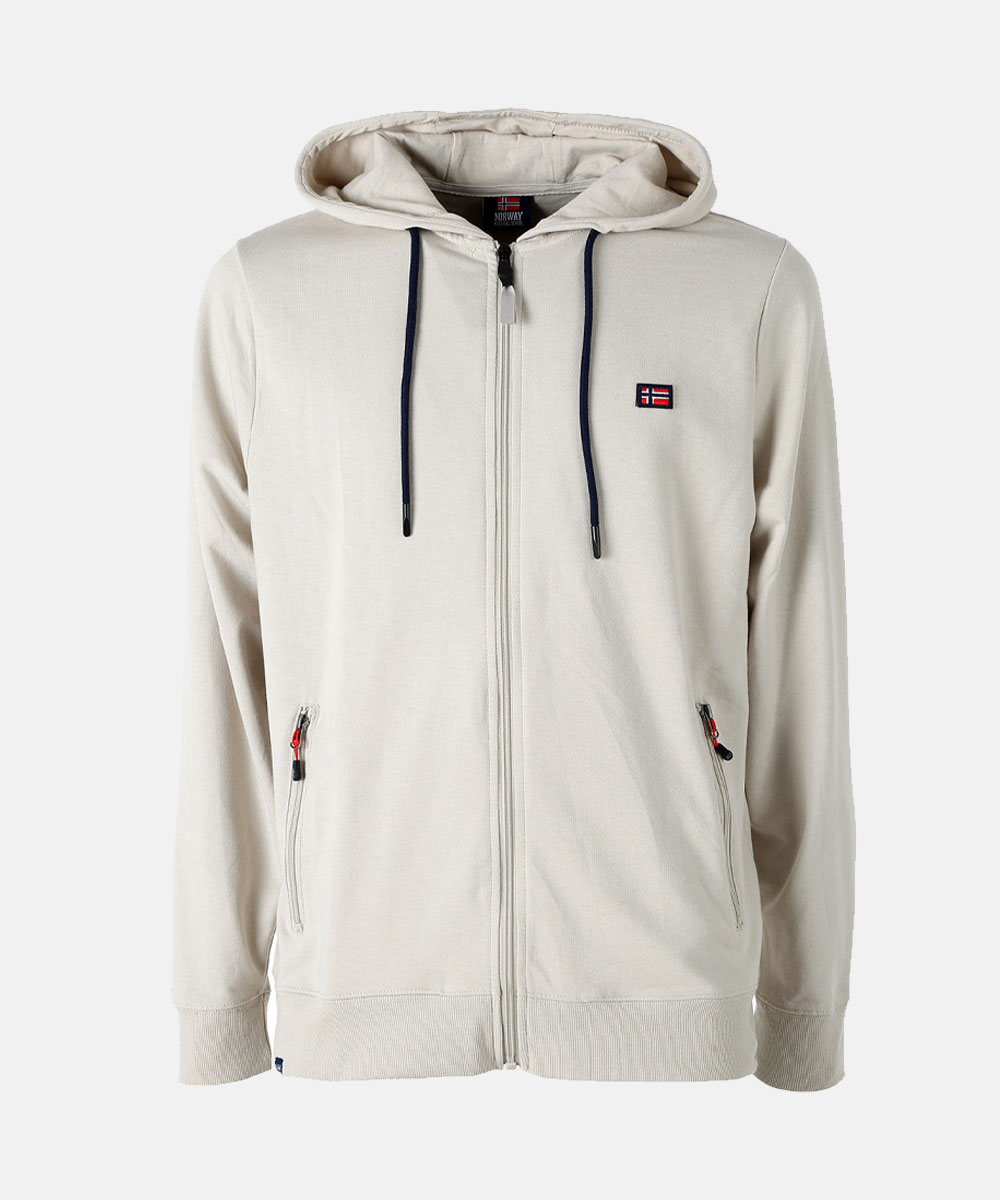 Beige full-zip hoodie with hood and navy drawstrings, small flag chest patch and zip pockets — casual men's sweatshirt