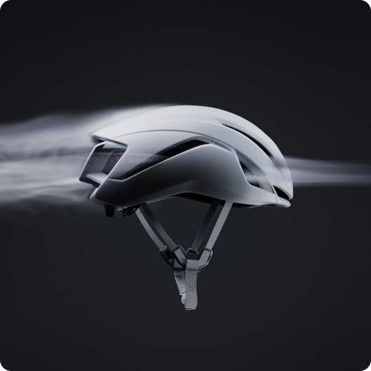 White aerodynamic cycling helmet with adjustable chin straps and visualised airflow trails on a dark background