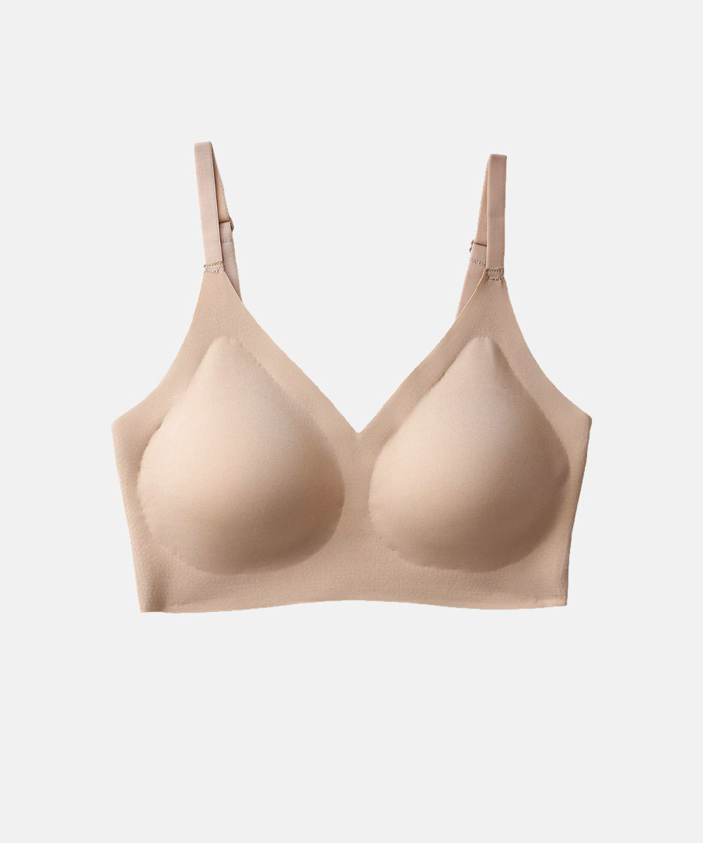 Beige seamless wireless moulded-cup bra with adjustable straps, nude everyday comfort bra for a smooth silhouette
