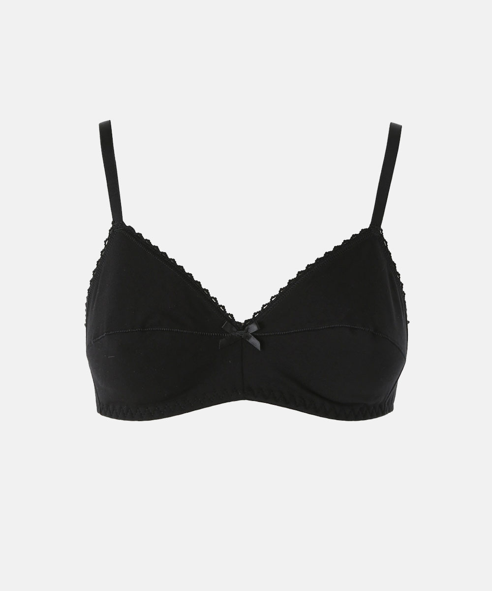 Black wireless cotton bra with adjustable thin straps, lace trim and centre bow on white background