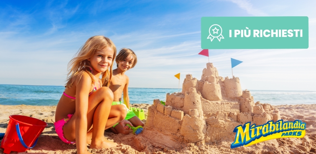 Two children building an elaborate sandcastle on a sunny beach with buckets and Mirabilandia Parks logo