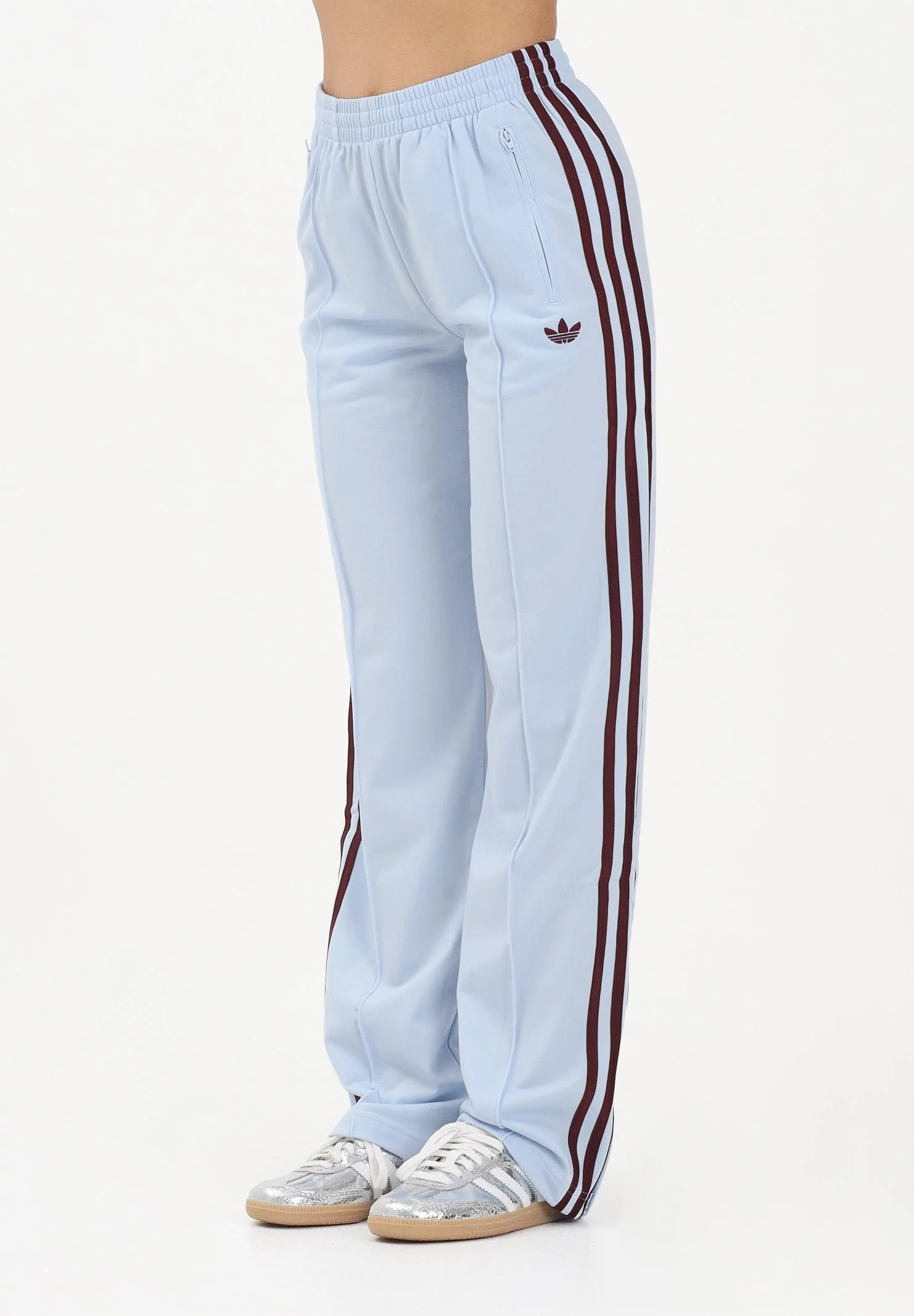 Image of ADIDAS ORIGINALS Pantalone sportivo Firebird Classic celeste e bordeaux da donna