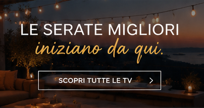 Cosy outdoor evening terrace with string lights and sea view, overlaid Italian text promoting TVs: 'Le serate migliori iniziano da qui'