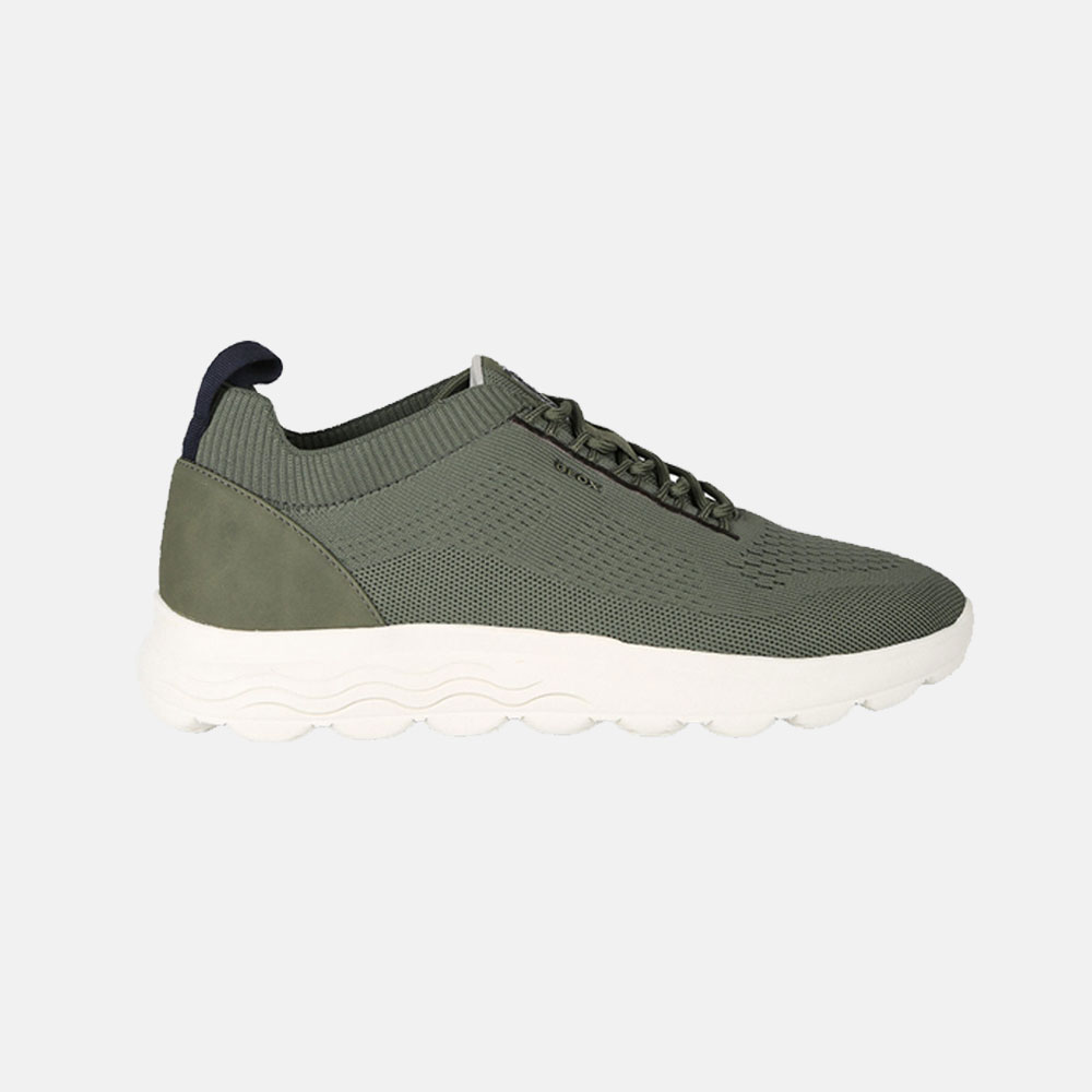 Green knitted men's trainer with white chunky sole, slip-on sock collar and lace detail, side view