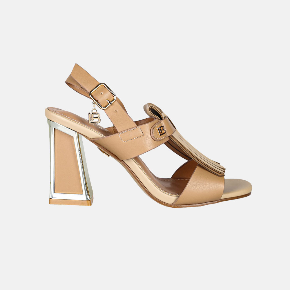 Tan leather high-heeled slingback sandal with gold-trimmed block heel, buckle strap and fringe tassel, side view on white background