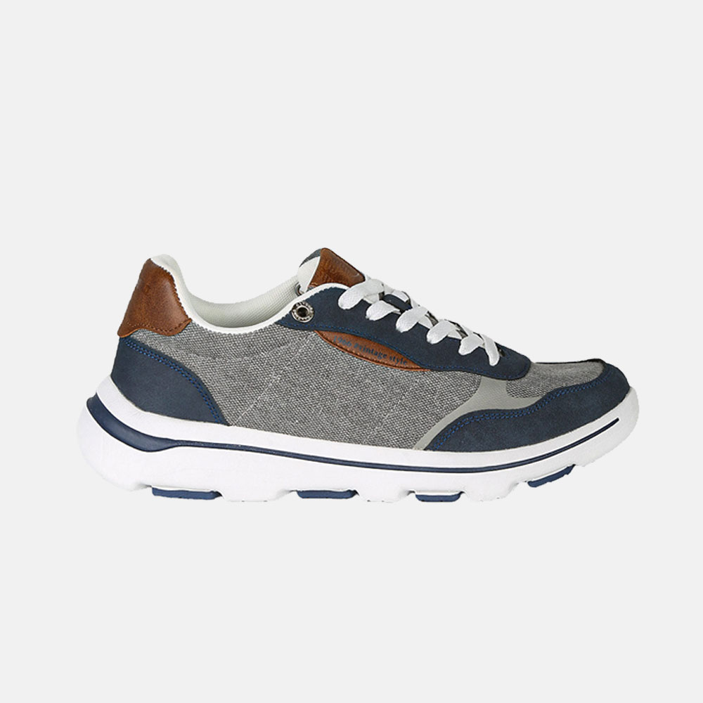 Men's casual navy and grey fabric sneaker with white chunky sole, brown leather heel accents and white laces