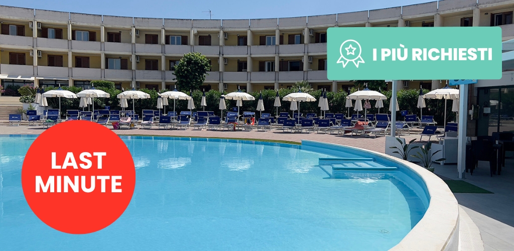 Outdoor hotel swimming pool with curved three-storey building, rows of sunbeds and umbrellas, and a prominent 'Last Minute' promotional badge