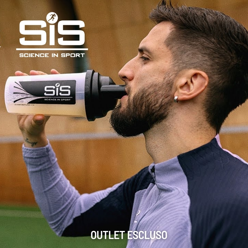 Athlete drinking from a SiS (Science in Sport) shaker bottle on a sports pitch, close-up profile view