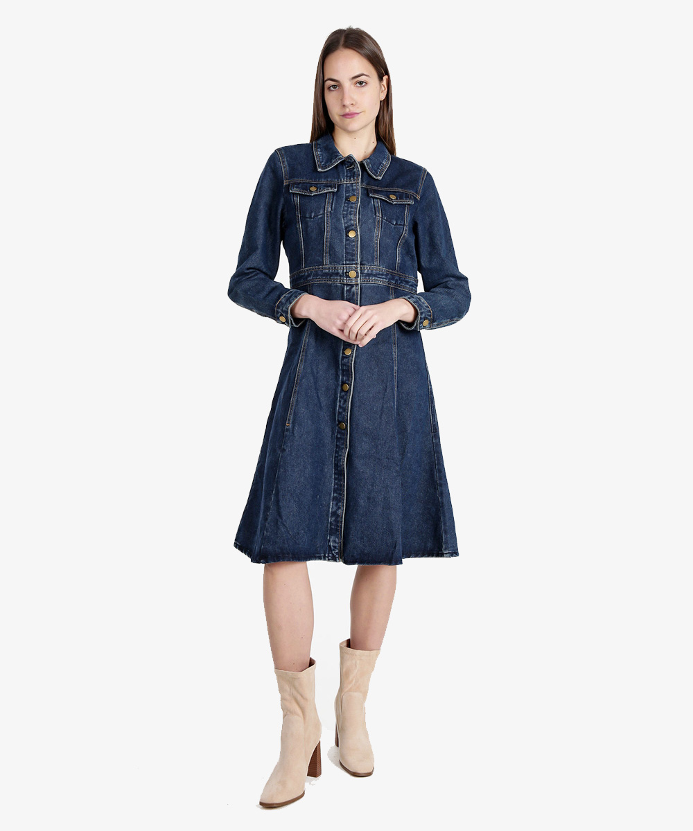 Woman wearing dark blue denim button-front midi dress with long sleeves and cream ankle boots on white background